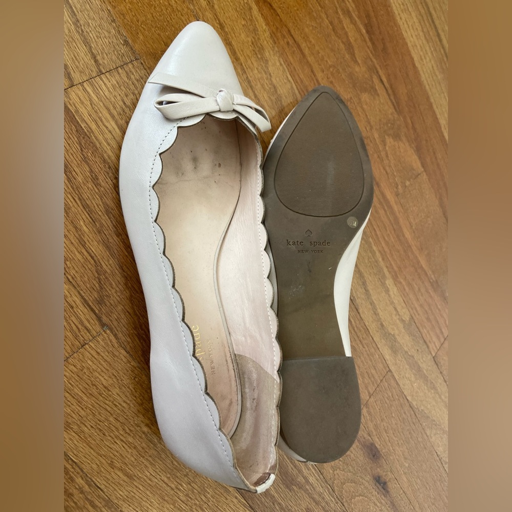 Kate Spade pale pink flats with bow and scallop details